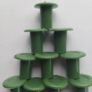 A close-up of Rubber Cane Caps (Green), durable rubber caps designed to fit over the ends of cane supports, ideal for protecting plants in UK gardens.