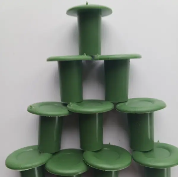 A close-up of Rubber Cane Caps (Green), durable rubber caps designed to fit over the ends of cane supports, ideal for protecting plants in UK gardens.
